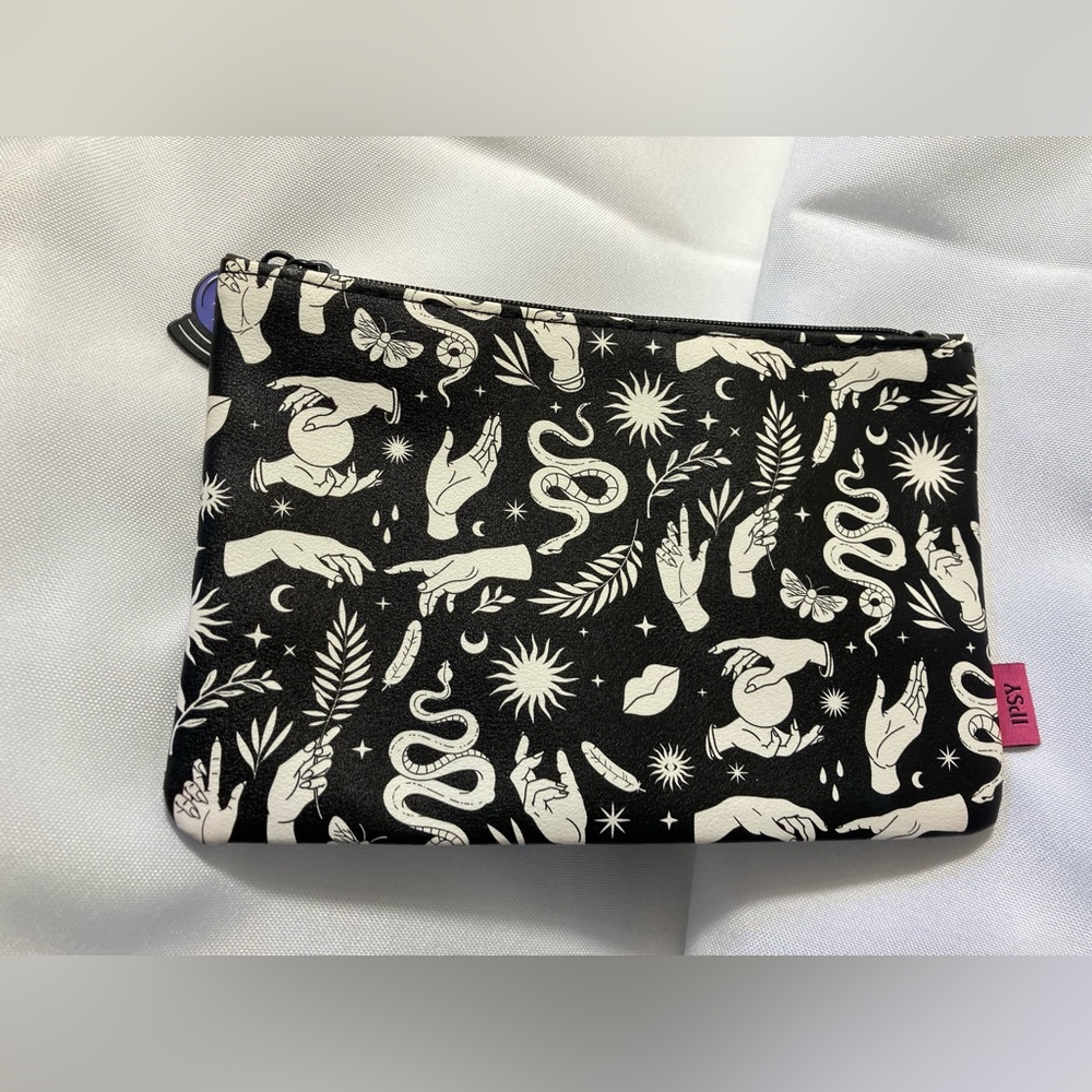Ipsy Bag in black with “palm reader” motif. NWOT.
Approx:  7.5” x 5”